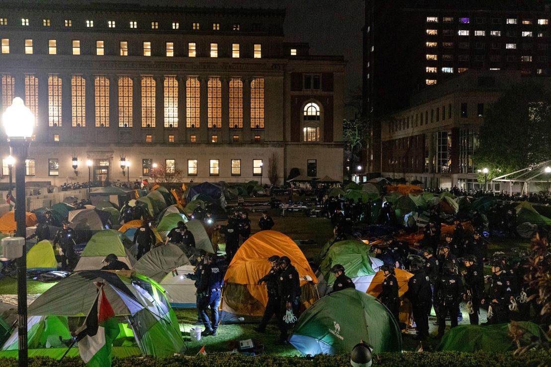 NYPD officers in riot gear enter Columbia University's encampment as they evict a building that had been barricaded by pro-Palestinian student protesters in New York City on April 30, 2024.