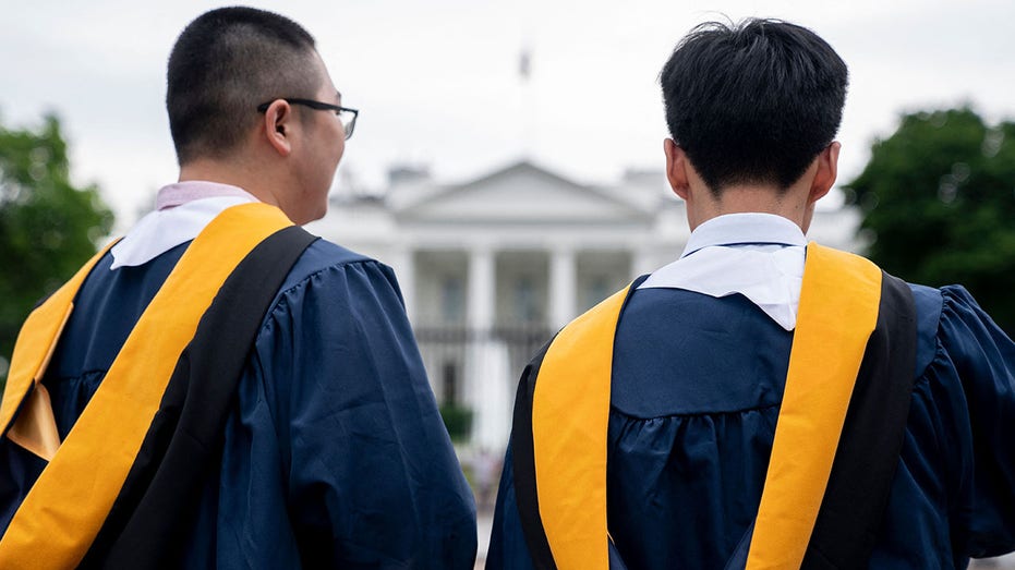 Students wearing their graduation gowns